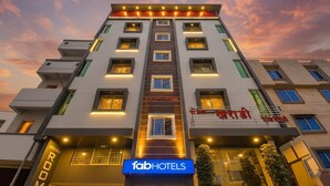 A multi-story hotel with a modern facade, multiple balconies, and a prominent signage for Tab Hotels. - Fabhotel Prime Kharadi Residency (Pune)
