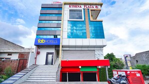 A multi-story building with a sign for 'Krishna Plaza' and 'Tab Hotels'. - Fabhotel Kyshna Inn (Mathura)