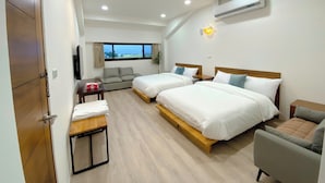 A hotel room with two beds, a sofa, a small table, and a TV. - 58mutian B&B (Zhuangwei)