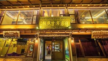 A building with a traditional architectural style, featuring a prominent entrance with a sign above it.