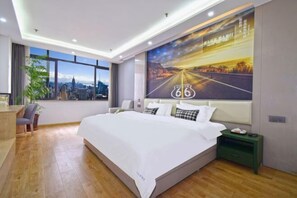 A modern hotel room with a large bed, a city view, and a mural of a road. - Hotel & Davos (Chongqing Ranjiaba Light Rail Station) (Chongqing)