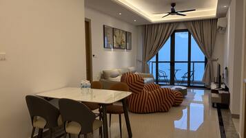 Luxury Apartment, Balcony, Sea View | Living area | 50-inch Smart TV with digital channels