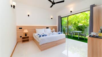 Deluxe Double Room, Patio, Garden View | In-room safe, desk, laptop workspace, iron/ironing board