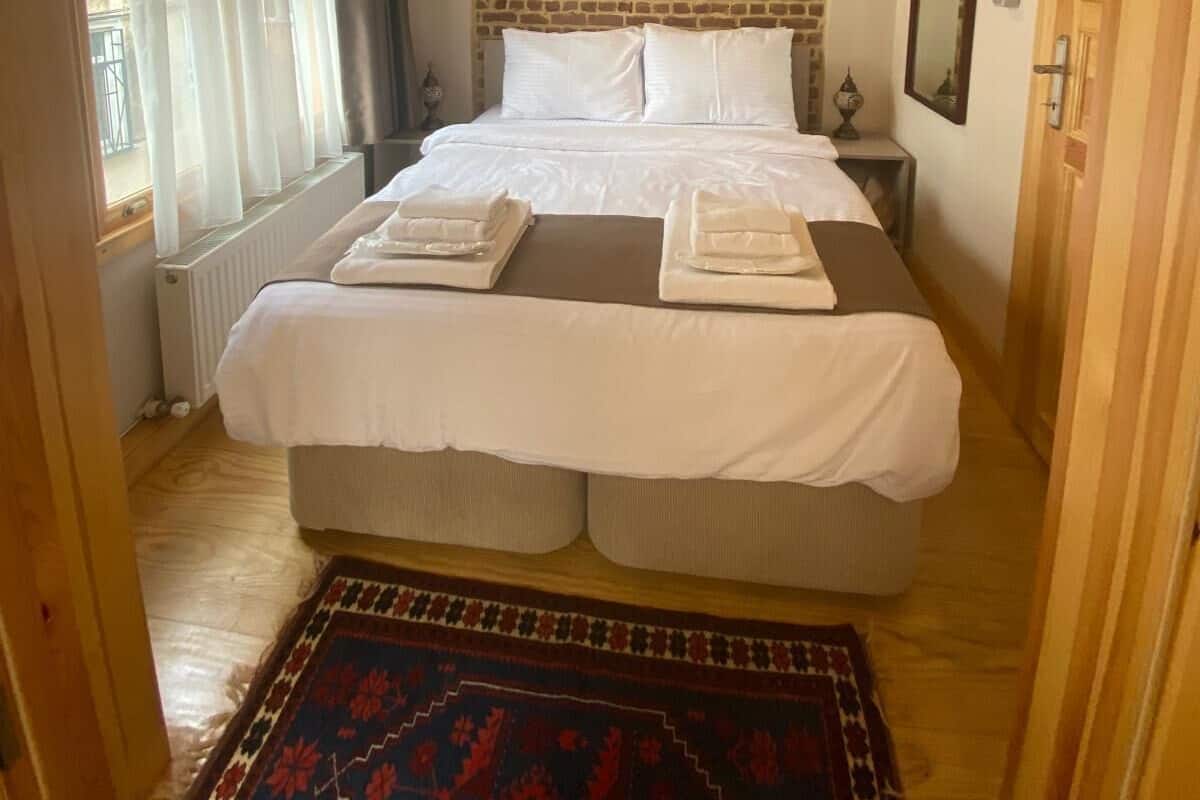 Premium bedding, desk, laptop workspace, soundproofing