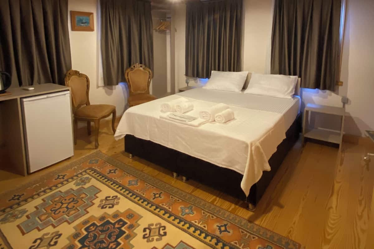 Premium bedding, down duvets, desk, laptop workspace