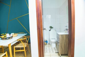 Shower, hair dryer, towels, toilet paper