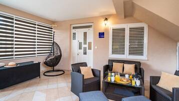 Apartment (Three Bedroom Apartment with Jacuzzi) | Living room | 32-inch flat-screen TV with digital channels