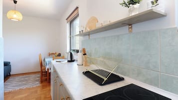 Departamento Confort, balcón | Cocina privada