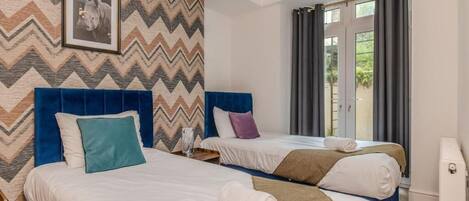 2 slaapkamers, een strijkplank/strijkijzer, gratis wifi, beddengoed