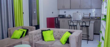 Apartment, Garden View | Living area | 32-inch Smart TV with digital channels