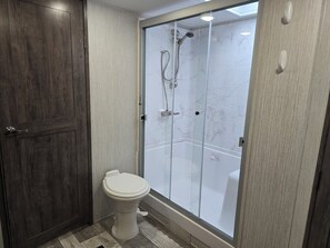 Shower, hair dryer, towels, soap