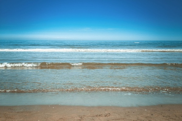 On the beach, sun loungers, beach towels