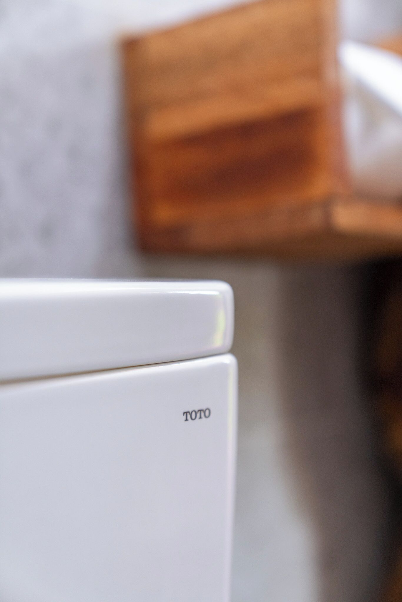 A white TOTO toilet with a visible brand name.