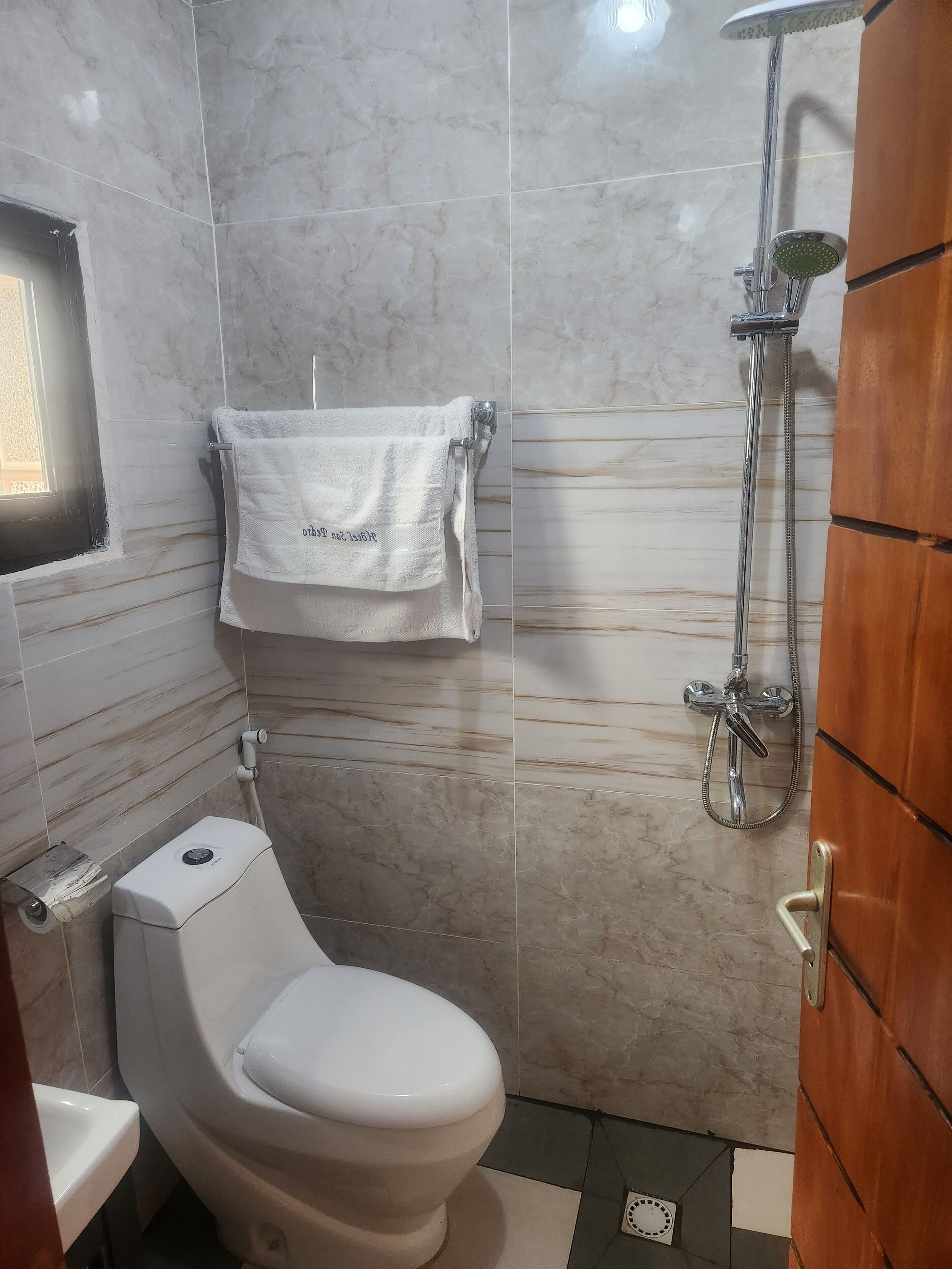 Shower, slippers, towels, soap