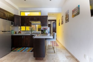 Fridge, microwave, stovetop, coffee/tea maker