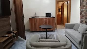 Quarto com design assinado | Área de estar