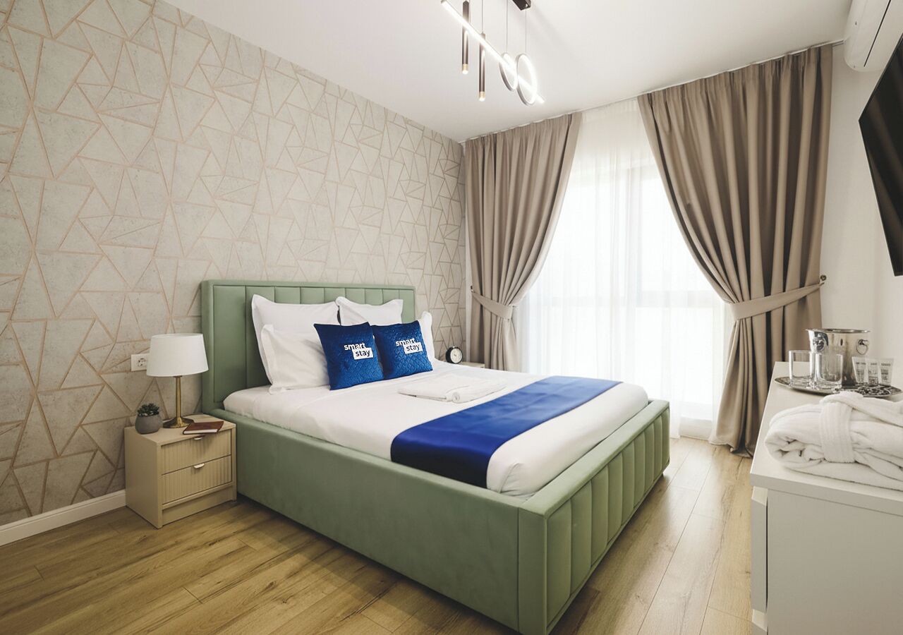 Chambre quadruple Deluxe | Décor unique, ameublement unique, rideaux d’obscurcissement