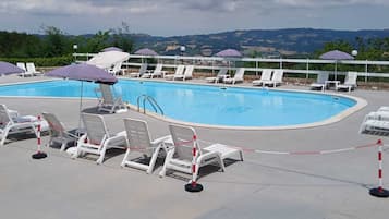 Seasonal outdoor pool, pool umbrellas, pool loungers