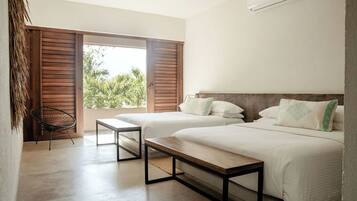 Habitación doble Deluxe, 2 camas matrimoniales | Wifi gratis