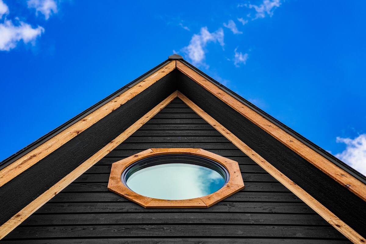 A triangular roof with a skylight.