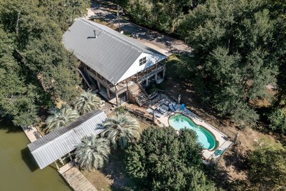 Stunning Riverside Retreat with Private Pool by RedAwning
