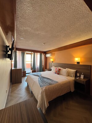 Senior Studio Suite, City View | In-room safe, blackout drapes, iron/ironing board, free WiFi