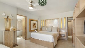 Un dormitorio moderno con una cama grande, un ventilador de techo y una obra enmarcada en la pared.