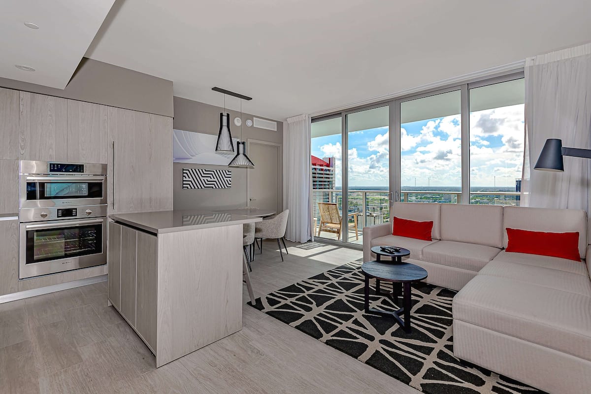 Luxury Apartment, 3 Bedrooms, Balcony | Living area | 50-inch Smart TV with cable channels
