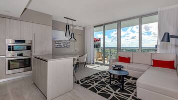 Luxury Apartment, 3 Bedrooms, Balcony, City View | Living area | 50-inch Smart TV with cable channels