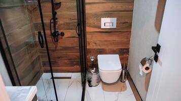 Shower, hair dryer, slippers, towels