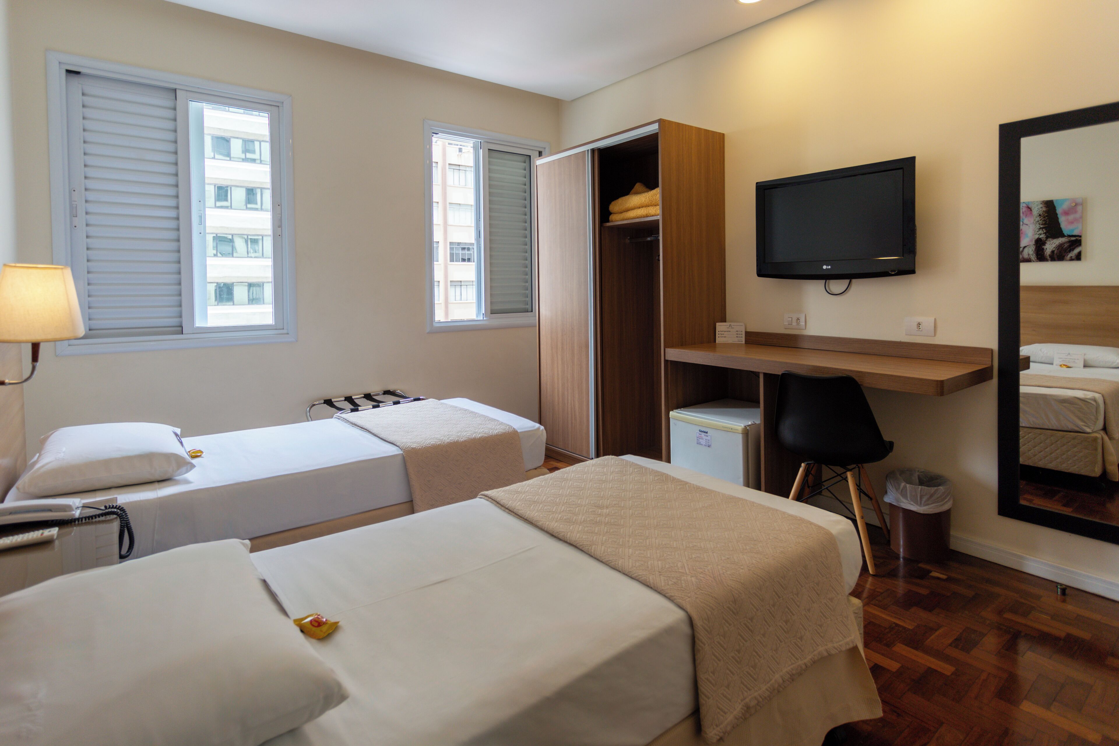 Comfort Twin Room, City View | In-room safe, desk, laptop workspace, iron/ironing board