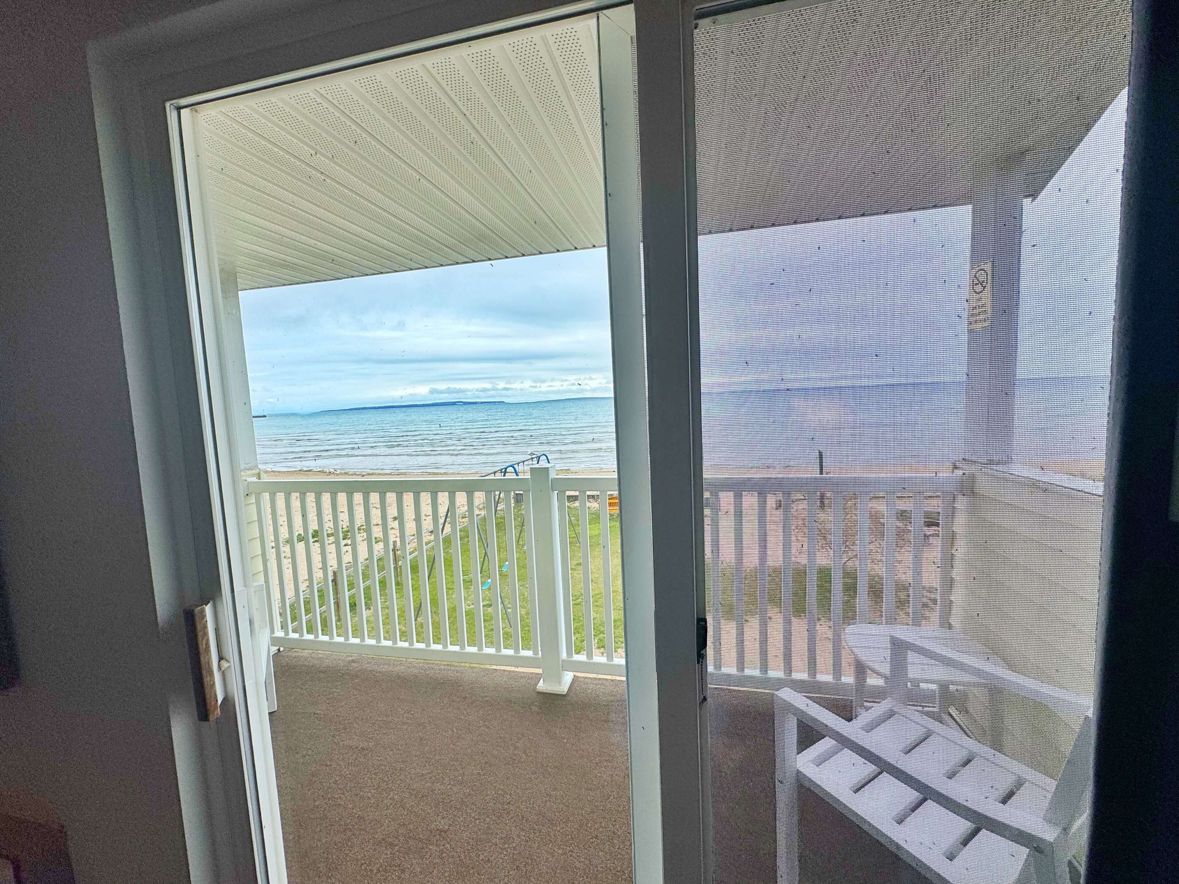 A balcony with a view of the ocean.