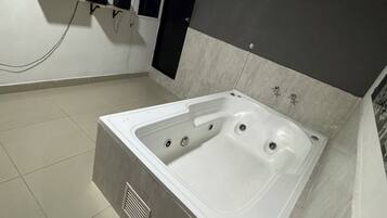 Luxury Room | Bathroom | Shower, towels, soap, toilet paper