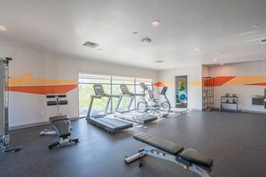 A gym with treadmills, a bench, and weight machines. - Heart of Tempe  Balcony, Pool, Gym, WD, Parking (Tempe)