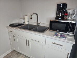 Fridge, microwave, stovetop, coffee/tea maker