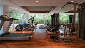 A gym with treadmills, stationary bikes, and weight machines. - 6-17 - 2 Bdr Condo With Balcony and Shared Pool (Patong)