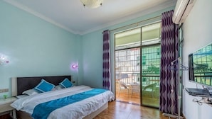 A bedroom with a bed, a nightstand, a window with curtains, and a view of the outside. - The story of Danxia Inn (Renhua)