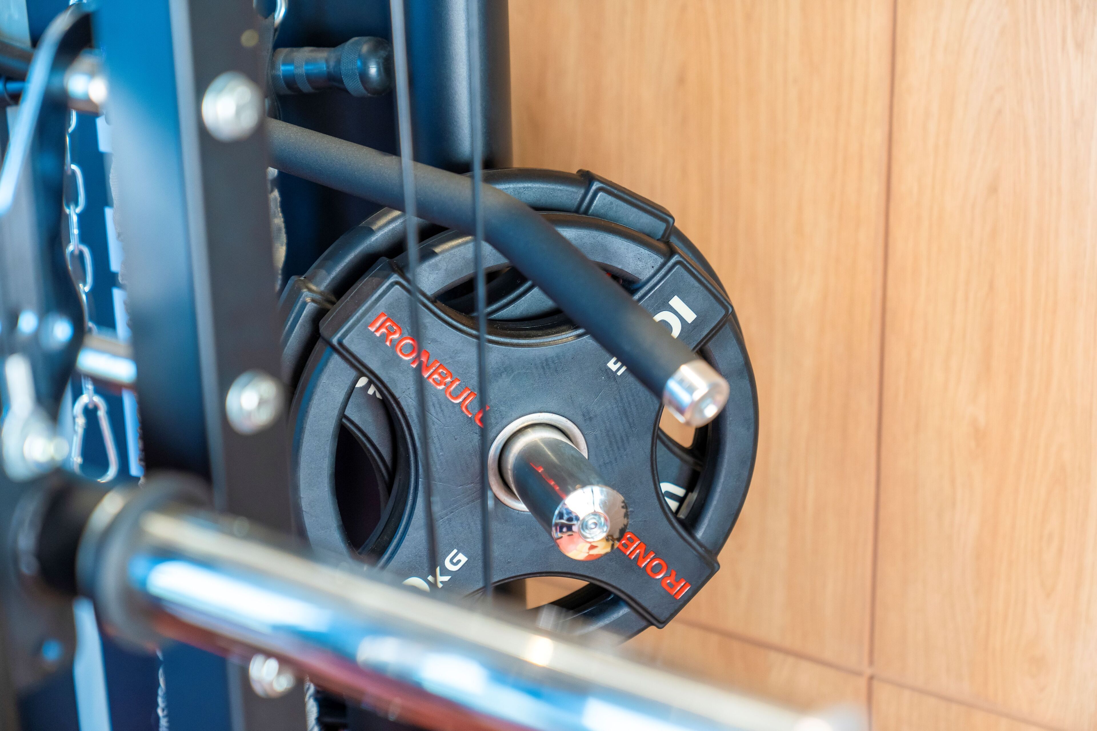 A close-up of a mechanical component with the text "IRONBULL" and "5KG" indicating its weight capacity.