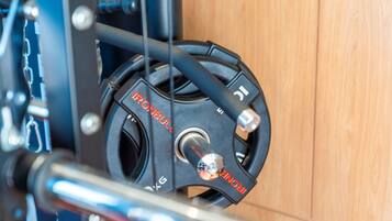 A close-up of a mechanical component with the text "IRONBULL" and "5KG" indicating its weight capacity.