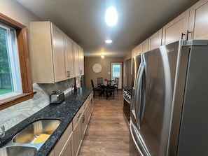 Coffee/tea maker, fridge, microwave, oven