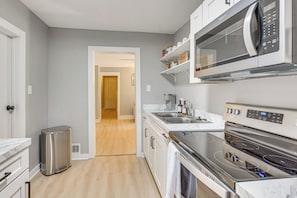 Fridge, microwave, stovetop, coffee/tea maker