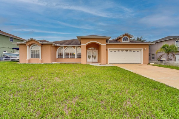 Haines City Vacation Rental | 4BR | 3BA | 2,500 Sq Ft | 1 Small Step to Enter