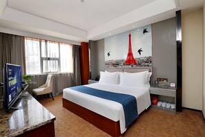 A hotel room with a large bed, a desk with a TV, a chair, a red decorative piece on the wall, and a shoe rack. - Starshar (Changsha)