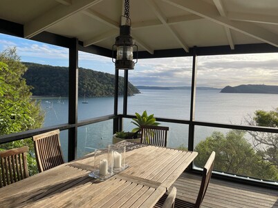 The Hideaway Beach House perched on the headland of Great Mackerel Beach
