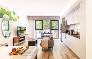 Enjoy cooking and dining in this well-equipped kitchen with a large window offering a view of the outdoors.