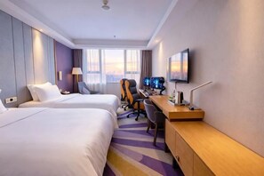 A hotel room with two beds, a desk with a computer, and a TV on the wall. - Lavande Hotels（Shenzhen Fanshen Metro Station&Wanda Plaza ） (Shenzhen)