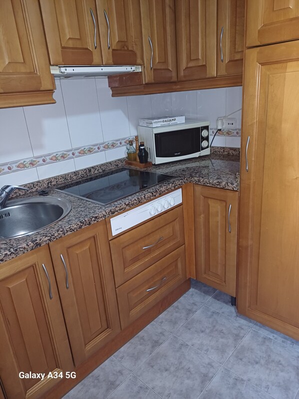 Fridge, microwave, oven, cookware/dishes/utensils