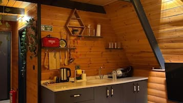 Mini-fridge, stovetop, cookware/dishes/utensils