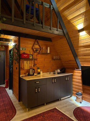 Mini-fridge, stovetop, cookware/dishes/utensils