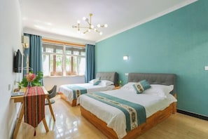 A room with two beds, a desk with a chair, a TV, and a window with curtains. - Moshang Huakai Inn (Tongxiang)